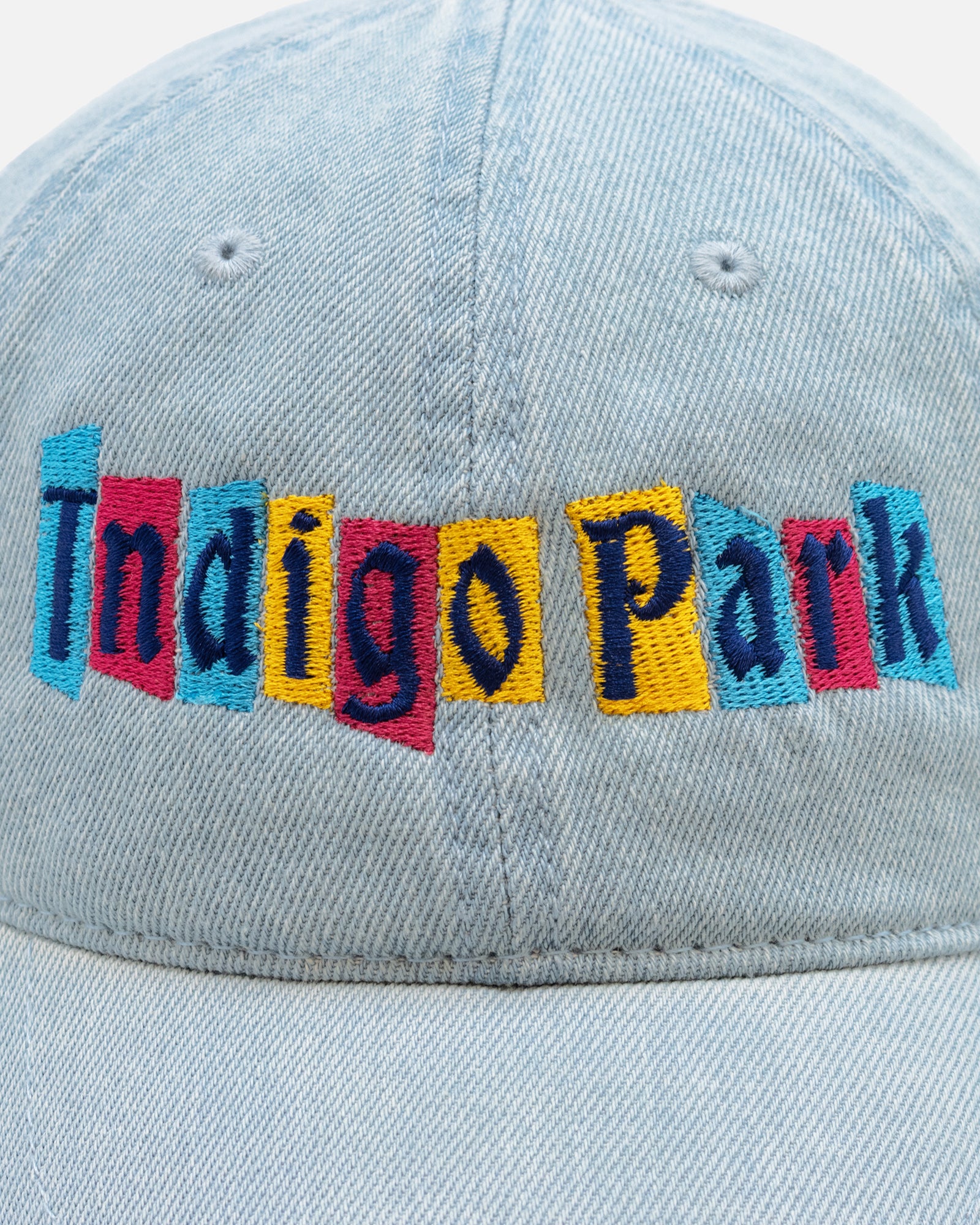 close up of indigo park logo on front of hat